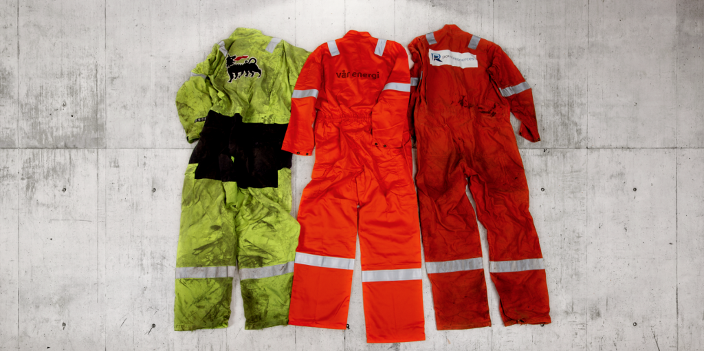 Three coveralls on the floor. Photo