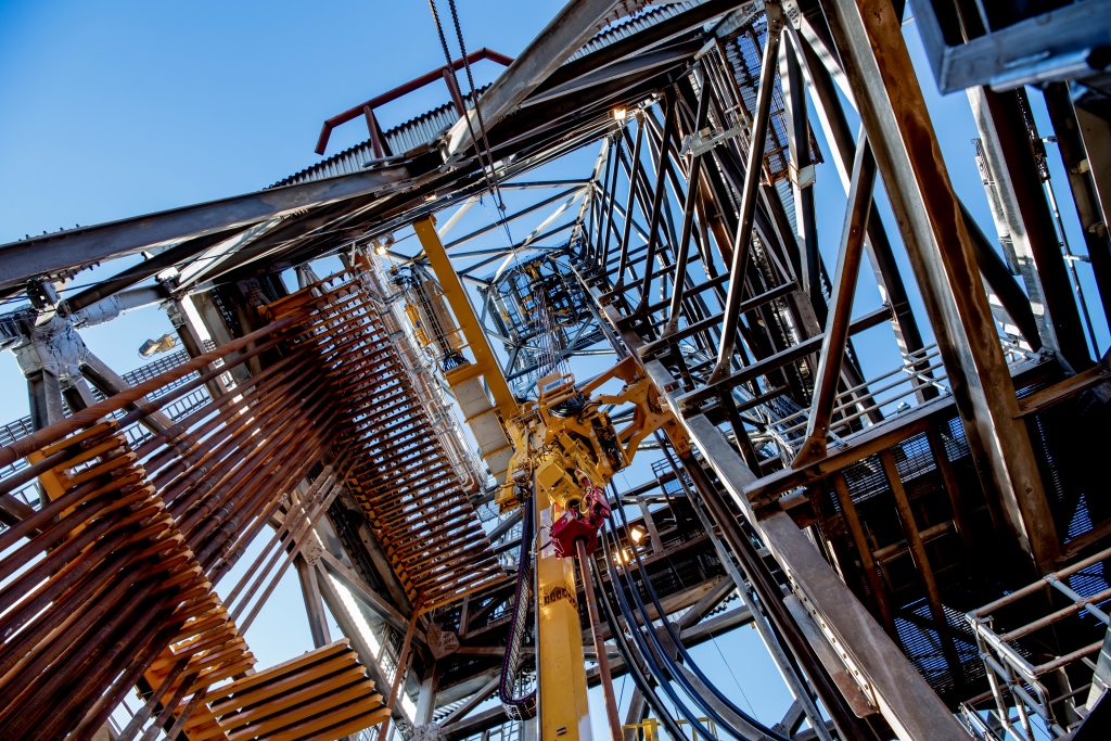 Drilling tower on platform seen from below. Photo.