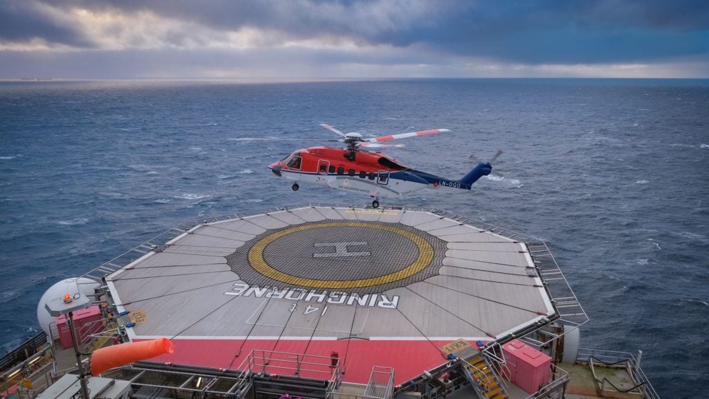 Helicopter landing on platform. Photo