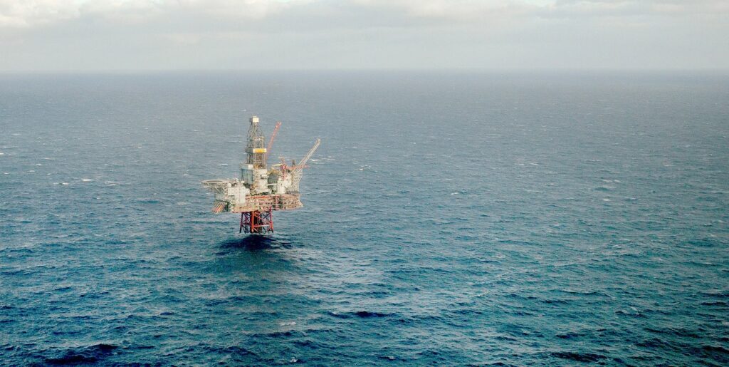 Offshore oil platform in calm sea. Photo.